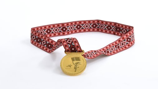 Medal awarded to all participants in the games. Photo courtesy of 3-2-1 Qatar Olympic and Sports Museum © 2026.