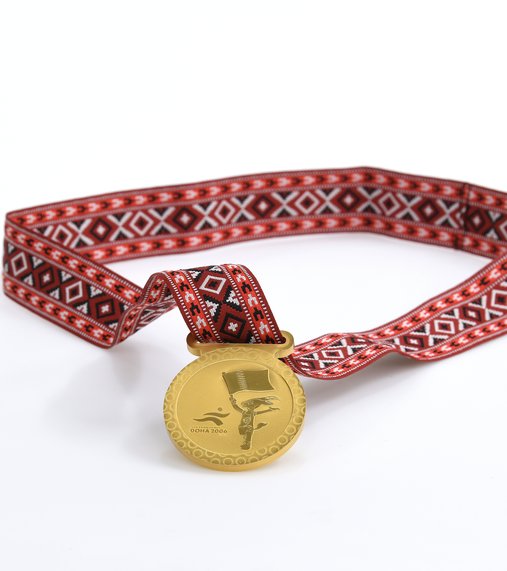 Medal awarded to all participants in the games. Photo courtesy of 3-2-1 Qatar Olympic and Sports Museum © 2026.