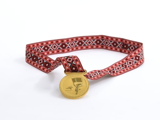 Medal awarded to all participants in the games. Photo courtesy of 3-2-1 Qatar Olympic and Sports Museum © 2026.