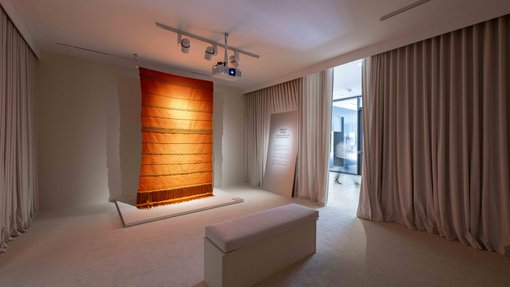 Exhibition space with an orange carpet