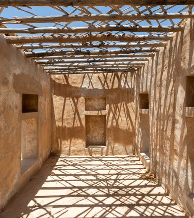 Inside an old house in Ain Mohammed village, the house has straight beams with openings as a roof.