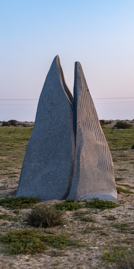 three marble sculptures with a manifold shape
