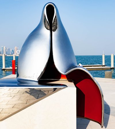 Abstract silver reflective sculpture of a Gulf woman