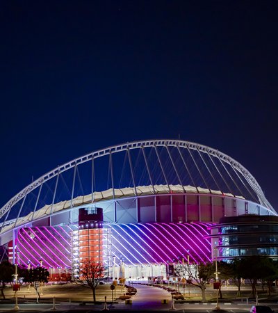 3-2-1 Qatar Olympic Sports Museum illuminated at night with brightly coloured lights