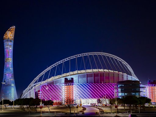 3-2-1 Qatar Olympic Sports Museum illuminated at night with brightly coloured lights