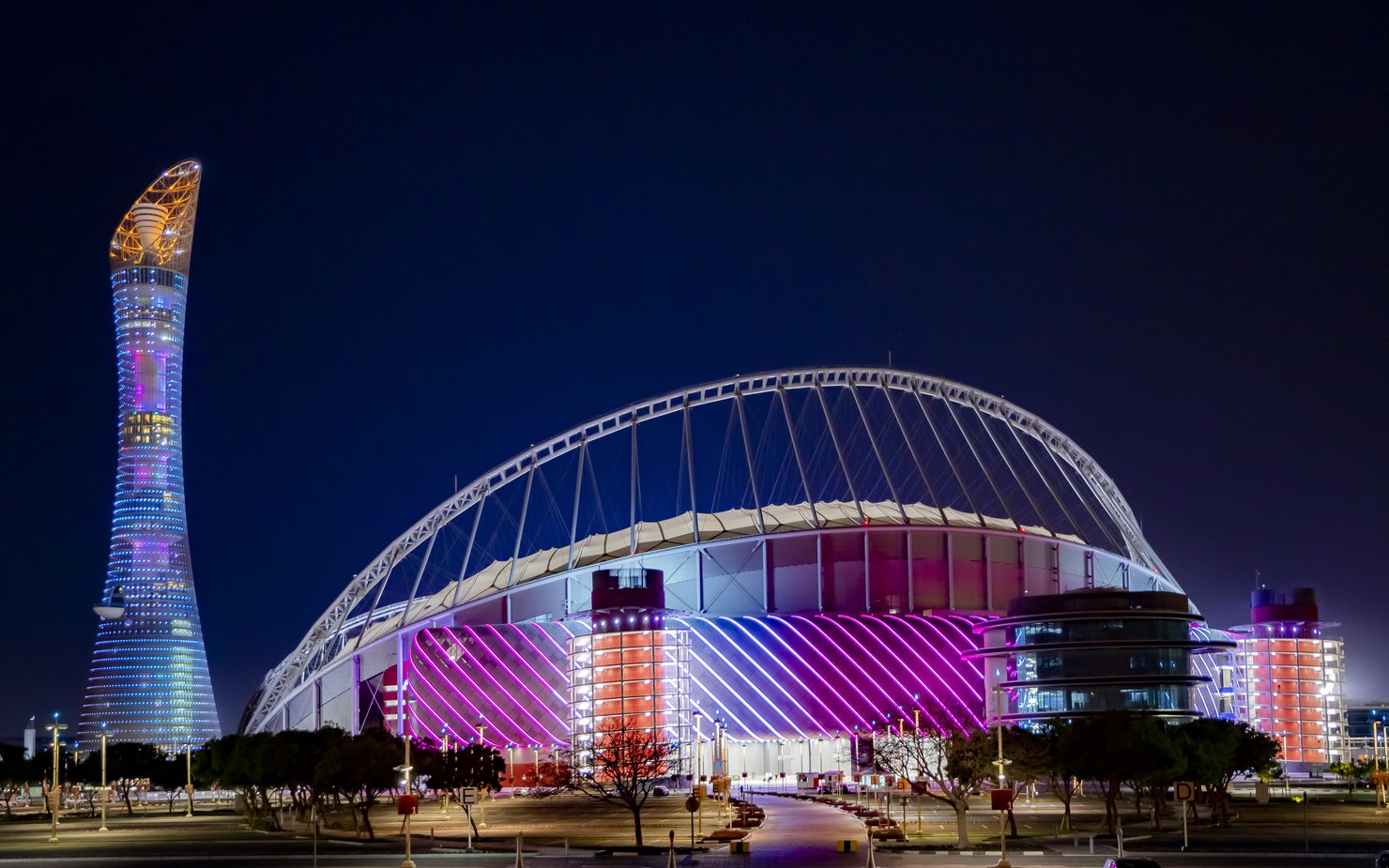 3-2-1 Qatar Olympic Sports Museum illuminated at night with brightly coloured lights