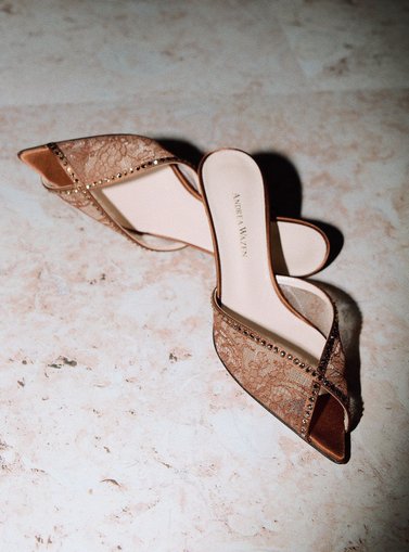 Beige shoes displayed on the floor