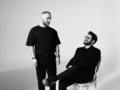 Black and white photo of designer duo
