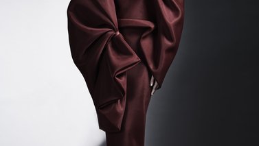 Model in a dark red evening dress