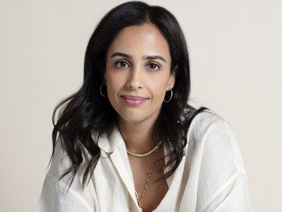 women seated and posing to camera