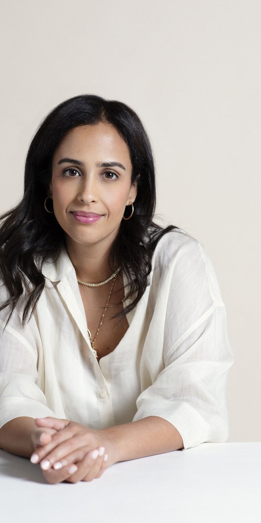 women seated and posing to camera