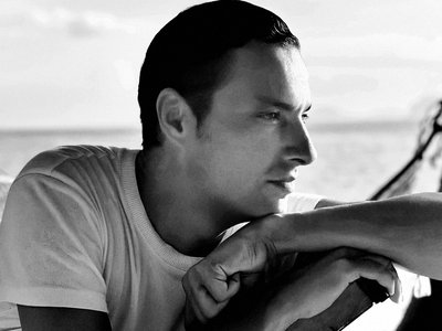 Black and white foto of designer staring away