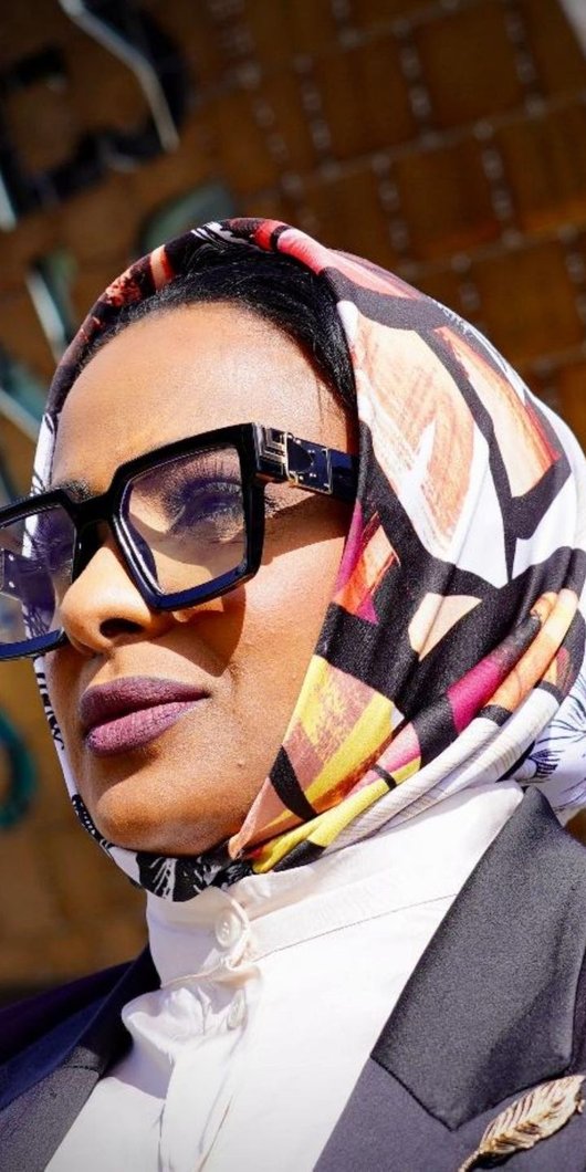 closeup of woman with sunglasses and headscarf