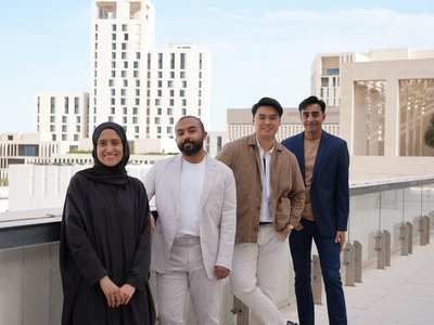 Four people in a terrace area