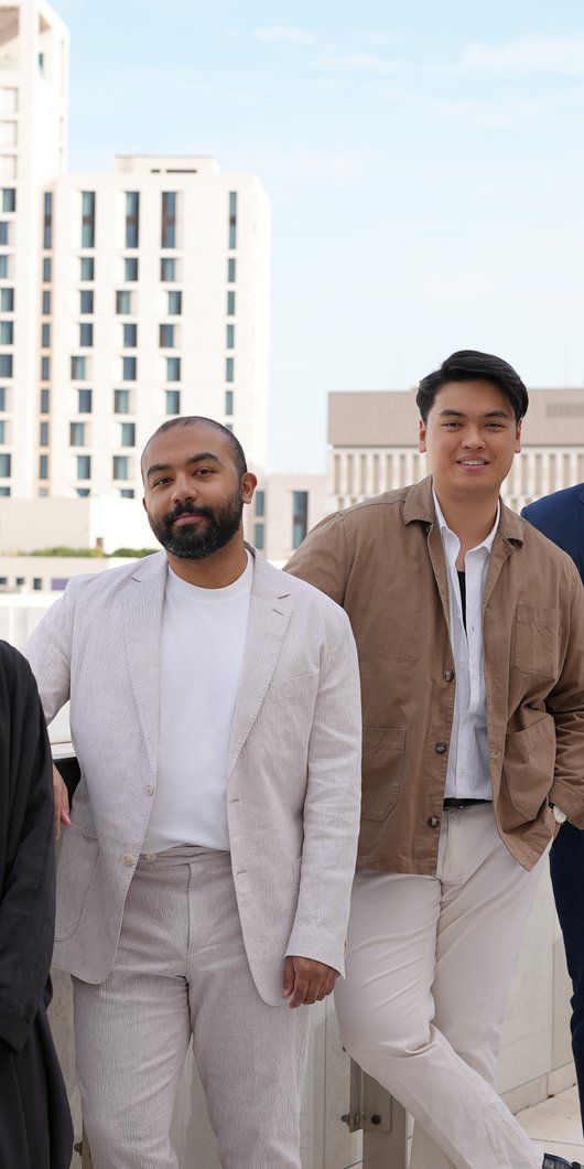 Four people in a terrace area