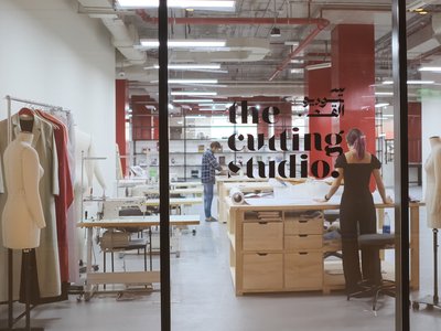 Sewing table and fashion production company space through the window