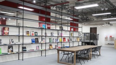 Space with wide book case and a table