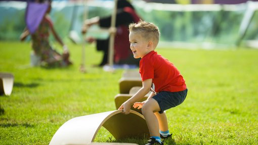 Child playing with a balance board.