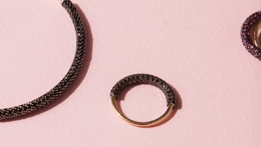 Jewellery displayed pink background