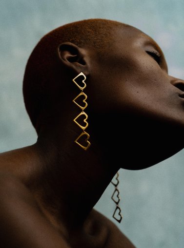 Woman with heart earrings