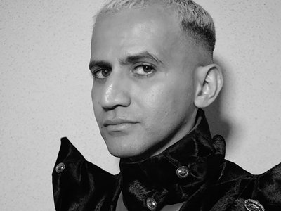 Black and white photo of a man staring into the camera