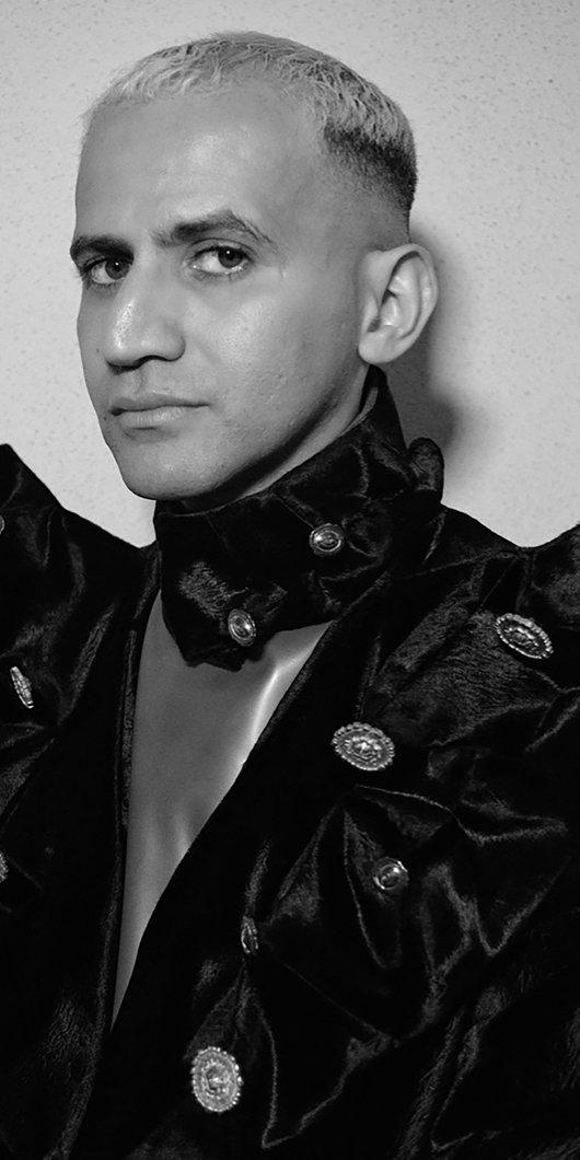 Black and white photo of a man staring into the camera