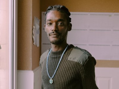 Man designer sitting on table