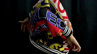 colorful sweater with hands