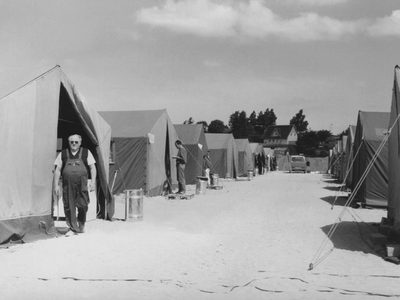a mam in black and white standing