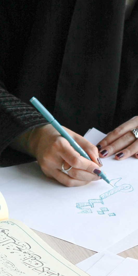 Sketches and someone doing Arabic calligraphy