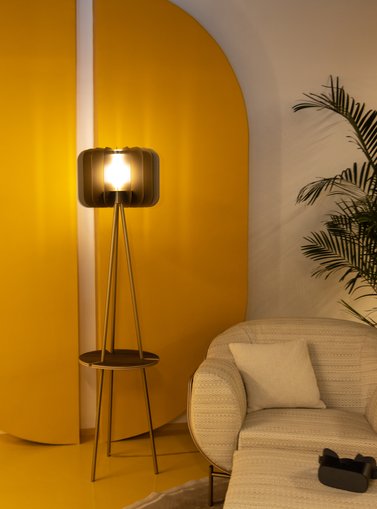 Armchar and a lamp in a yellow room