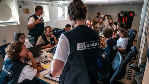 A group of researchers gathered around a table