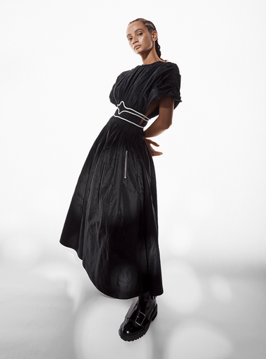 Model posing in a black dress