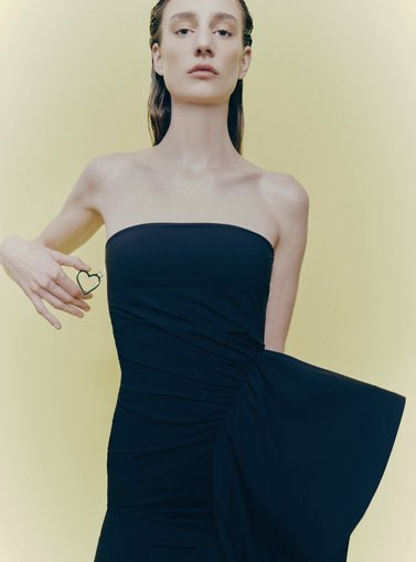 Woman in a strapless black dress