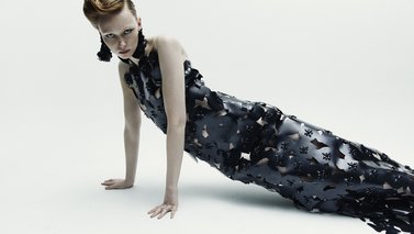 Model laying on the ground posing