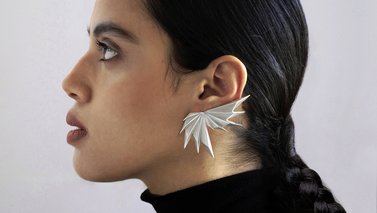 Model showcasing earrings side profile