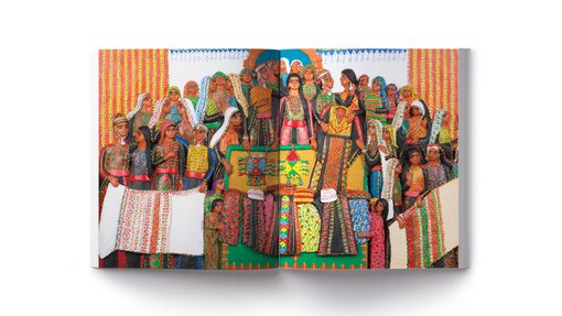 A colourful spread showing a number of women characters in Palestinian embroidered dresses