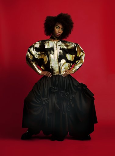 Model in a jacket and big black skirt