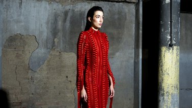 Model in long red dress