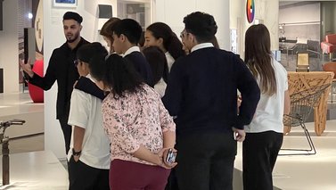 Tour guide giiving a tour to a group of students