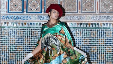 Model posing with light blue colors