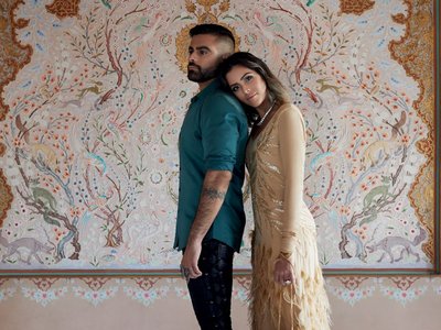 two people leaning on eachother