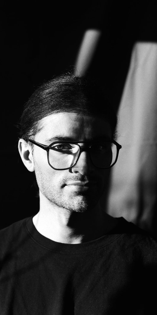 Black and white image of man with glasses