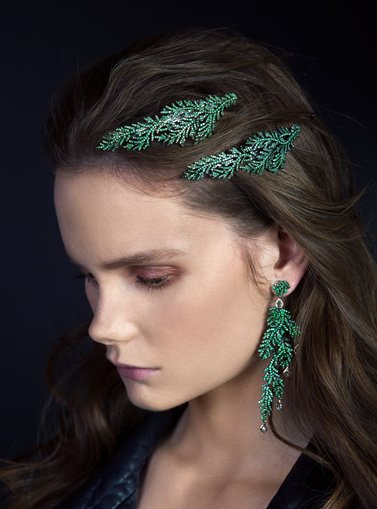 girl with glitter in hair and earring