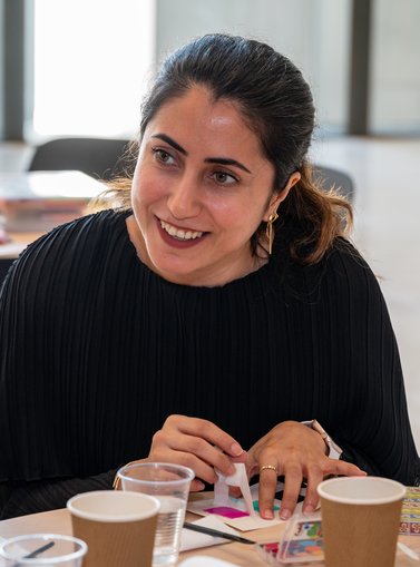 woman smiling while crafting