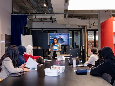 Someone prensenting in front of a group