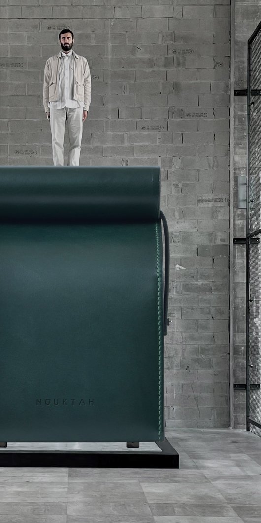 Big box with a person standing on top of it