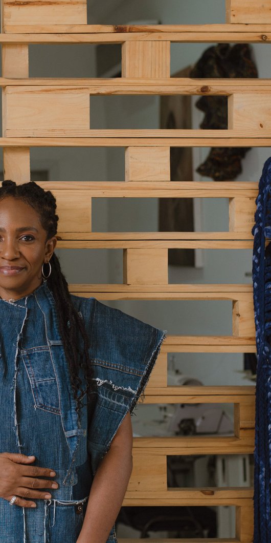 Woman in front of wall with patterns
