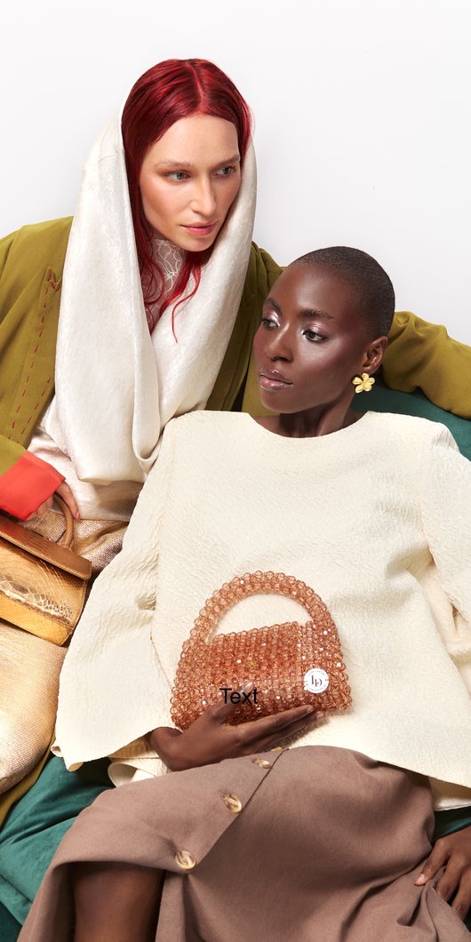women sitting on a green bean bag