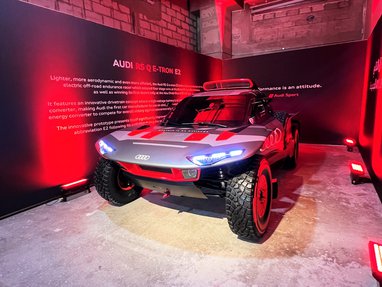 Audi RS Q e-tron E2 car displayed inside the Mawater Warehouse.